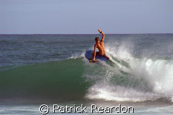 Boogie boarder carves up the waves in Kauai, Hawaii.  Sta... by Patrick Reardon 